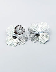 Everyday luxury fashion jewelry statement flower studs by Biya Accessoires Dubai.