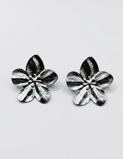 Best fashion jewelry in UAE silver metallic flora statement studs.