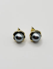 Biya Accessoires two-tone metallic dome stud earrings with gold rim.