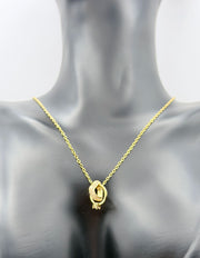 Waterproof non-tarnish artificial gold jewelry resting in a luxury green presentation box.