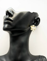 Everyday luxury fashion jewelry gold tone pearl blossom studs by Biya Accessoires Dubai.