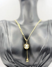 Biya Accessoires 18K gold plated bear medallion lariat necklace with mother of pearl.