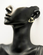 Close-up of premium hypoallergenic imitation jewelry featuring a black triangle and crystal frame.