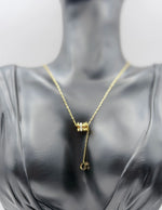 Close-up of premium hypoallergenic imitation jewelry featuring a cylinder slider pendant.