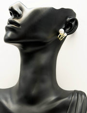 Everyday luxury fashion jewelry gold tone pearl huggies by Biya Accessoires Dubai.