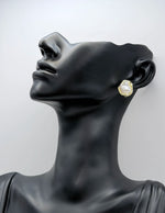 Everyday luxury fashion jewelry gold tone statement studs by Biya Accessoires Dubai.