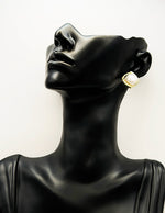 Everyday luxury fashion jewelry gold tone statement studs by Biya Accessoires Dubai.