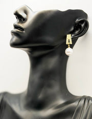 Close-up of premium hypoallergenic imitation jewelry featuring a large white pearl drop.