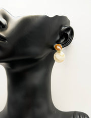 Close-up of premium hypoallergenic imitation jewelry featuring a marbled stone design.