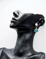 Close-up of premium hypoallergenic imitation jewelry featuring a nautical pearl design.