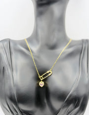 Close-up of premium hypoallergenic imitation jewelry featuring a pave safety pin.
