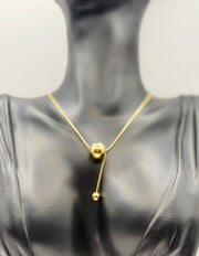 Biya Accessoires 18K gold plated minimalist sphere lariat necklace with snake chain.