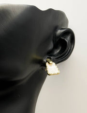 Close-up of premium hypoallergenic imitation jewelry featuring a textured gold frame.