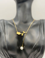 Close-up of premium hypoallergenic imitation jewelry featuring mother of pearl tulip pendant.