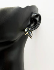 Best fashion jewelry in UAE botanical leaf earrings with emerald black enamel.