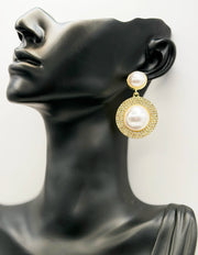 Close up of elegant imitation jewelry uae featuring oversized faux pearls and a crystal pavé setting.