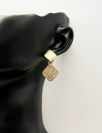 Best imitation jewellery brands in uae gold geometric studs with resin and crystals.