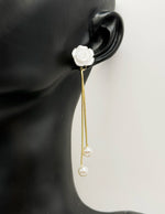 Best imitation jewellery brands in uae gold rose studs with hanging pearl chains.