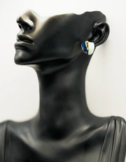 Close up of premium hypoallergenic imitation jewelry featuring a marbled resin design.