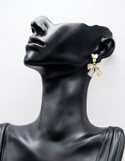 Everyday luxury fashion jewelry gold tone geometric drops by Biya Accessoires Dubai.