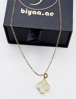 Modern luxury gold and pavé crystal reversible statement necklace.