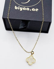 Modern luxury gold and pavé crystal reversible statement necklace.
