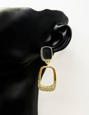 Close up of premium hypoallergenic imitation jewelry featuring a black stud and crystal frame.
