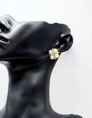 Close-up of premium hypoallergenic imitation jewelry featuring a gold textured cross.