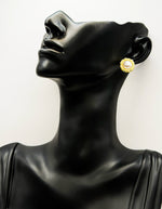 Best fashion jewelry in UAE textured gold and pearl statement studs.