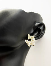 Close up of premium hypoallergenic imitation jewelry featuring an enamel and crystal insect design.