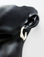 Elegant twisting two color statement earrings for women.