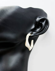 Elegant twisting two color statement earrings for women.