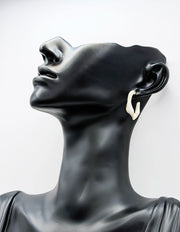 Everyday luxury fashion jewelry gold tone enamel hoops by Biya Accessoires Dubai.