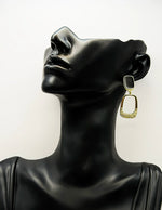 Everyday luxury fashion jewelry gold tone geometric drops by Biya Accessoires Dubai.