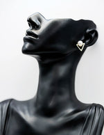 Close-up of premium hypoallergenic imitation jewelry featuring a triangle pearl design.
