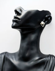 Close-up of premium hypoallergenic imitation jewelry featuring a triangle pearl design.