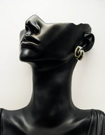 Everyday luxury fashion jewelry gold tone statement studs by Biya Accessoires Dubai.
