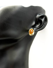 Close-up of premium hypoallergenic imitation jewelry featuring an amber brown stone.