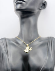 18K gold plated double heart pendant necklace with mother of pearl and crystals.