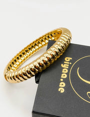 Non-tarnish fluted gold statement cuff for women Dubai luxury fashion.
