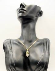 Waterproof vintage royal heart gold jewelry on silk background.
