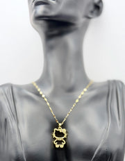 Waterproof gold feline bow necklace with cubic zirconia on silk.