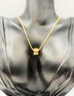 Waterproof gold ribbed geometric necklace on box chain.