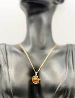 Hypoallergenic non-tarnish gold abstract sun and moon necklace.