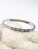 Hypoallergenic non-tarnish high polish silver rigid geometric bangle UAE.