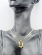 Premium quiet luxury gold organic shape necklace gift Dubai.