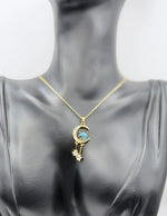 Waterproof celestial gold necklace with dangling crystal stars in gift box.