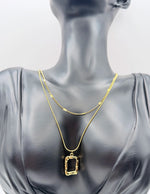 Modern luxury gold layered satellite and snake chain necklace set.