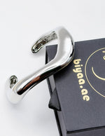Hypoallergenic thick silver undulating architectural cuff United Arab Emirates.