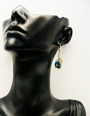Best imitation jewellery brands in uae gold peacock earrings with deep blue teardrop stones.